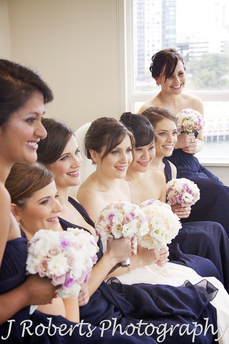 Bride smiling with bridesmaids - wedding photography sydney